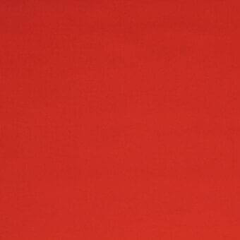 Red stretch fabric with a tight weave and subtle sheen, displaying a uniform saturated color and smooth texture in diffused studio lighting.